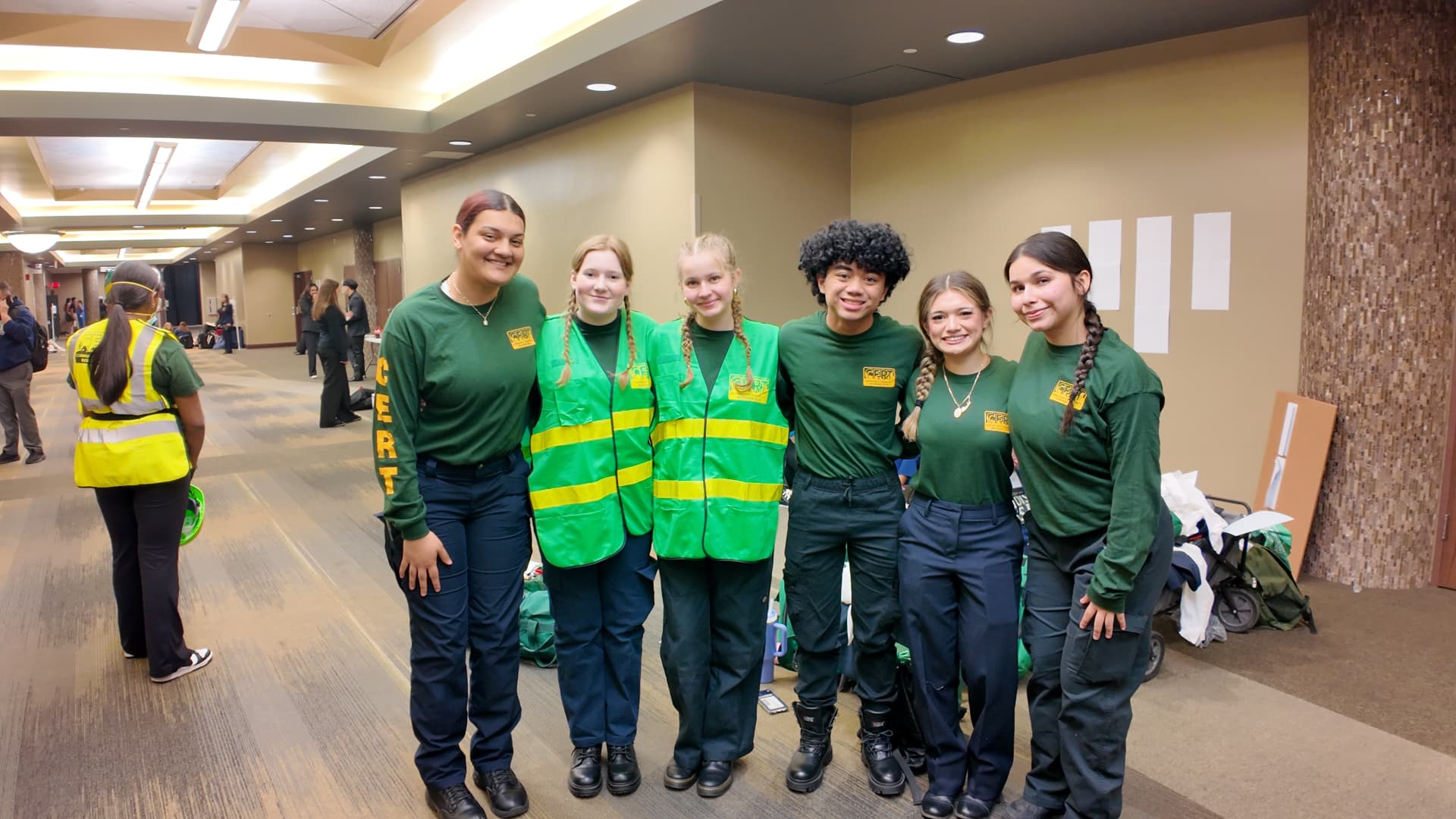 A CERT team poses together at a competitive event